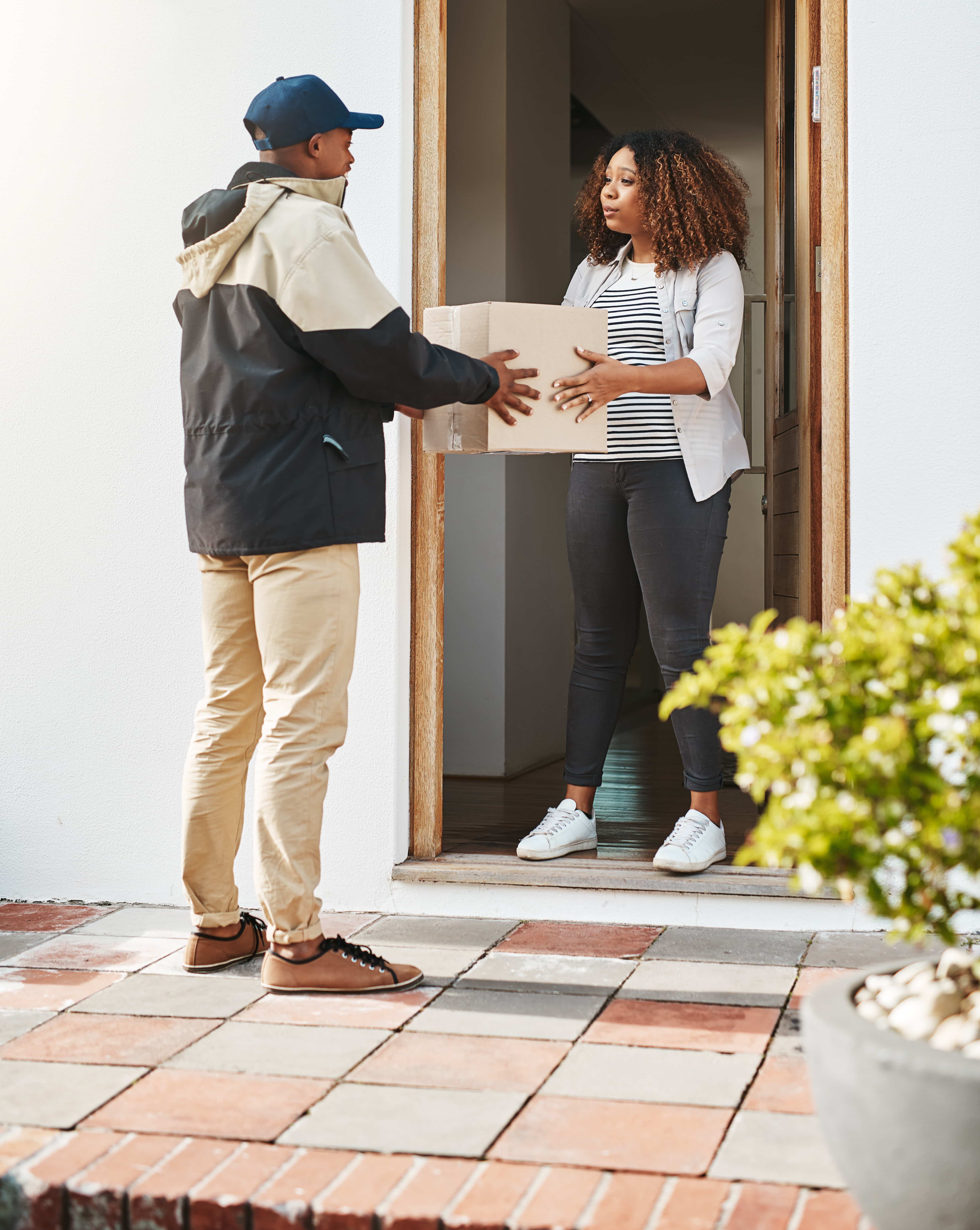 Courier making a delivery to a customer.